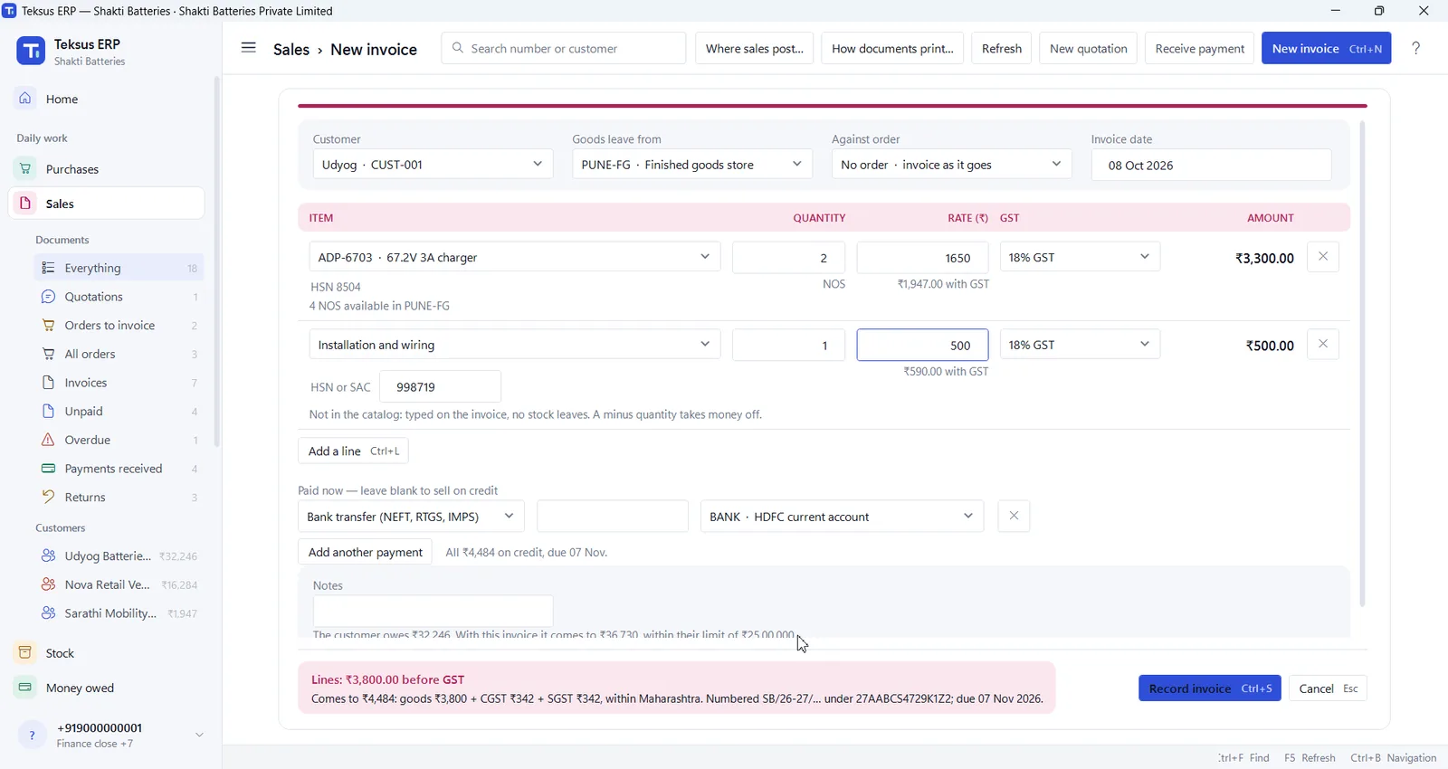 A new invoice in Teksus ERP with a charger, a service line and the GST total
